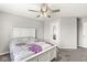 Comfortable bedroom features a ceiling fan and window, providing a relaxing and inviting space at 474 Pekin Way, Pendleton, IN 46064