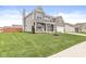 Well-maintained home featuring a spacious lawn and inviting front porch, perfect for relaxing outdoors at 474 Pekin Way, Pendleton, IN 46064