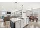 Spacious kitchen island offers ample seating, a sink, and a view into the inviting living room at 474 Pekin Way, Pendleton, IN 46064