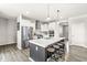 Modern kitchen with stainless steel appliances, a large center island, and stylish pendant lighting at 474 Pekin Way, Pendleton, IN 46064