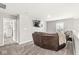 Cozy upstairs living room provides a comfortable space for relaxation and entertainment, with a mounted TV at 474 Pekin Way, Pendleton, IN 46064