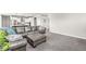 Spacious living area connected to the kitchen, featuring comfortable seating and ample natural light at 474 Pekin Way, Pendleton, IN 46064