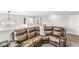 Upstairs living room features comfortable seating and a modern chandelier, perfect for relaxation and entertainment at 474 Pekin Way, Pendleton, IN 46064