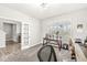 A stylish home office with carpet flooring and large windows providing abundant natural light at 474 Pekin Way, Pendleton, IN 46064