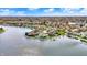 Attractive aerial view showcasing waterfront homes with manicured lawns and private boat docks at 4883 Snowberry Bay Ct, Carmel, IN 46033