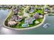 Aerial view of a lakeside neighborhood featuring landscaped lawns, mature trees, and beautiful homes at 4883 Snowberry Bay Ct, Carmel, IN 46033