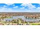 Expansive aerial view showcasing a vibrant lakeside community with lush landscapes at 4883 Snowberry Bay Ct, Carmel, IN 46033