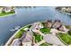 Luxury waterfront property featuring a stunning home, lush lawn, and a private boat dock at 4883 Snowberry Bay Ct, Carmel, IN 46033
