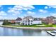 Charming waterfront home with backyard pool, lawn, and a private dock offering lake access at 4883 Snowberry Bay Ct, Carmel, IN 46033