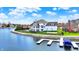 Lovely lakefront home featuring a private backyard with pool, patio, and personal dock at 4883 Snowberry Bay Ct, Carmel, IN 46033