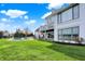View of backyard featuring in-ground pool, lounge chairs, deck, and lake views at 4883 Snowberry Bay Ct, Carmel, IN 46033