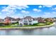Elegant lakefront home, complete with swimming pool, lush backyard, and private boat dock at 4883 Snowberry Bay Ct, Carmel, IN 46033