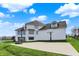 Rear exterior view of basketball court, yard, and lake at 4883 Snowberry Bay Ct, Carmel, IN 46033