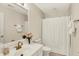 Bathroom with white vanity, gold fixtures, and a shower with a white curtain at 4883 Snowberry Bay Ct, Carmel, IN 46033