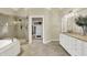 The primary bathroom boasts a glass shower and a seamless transition to the expansive walk-in closet at 4883 Snowberry Bay Ct, Carmel, IN 46033
