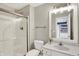 Bathroom with gray walls, a glass shower, a white vanity, and modern lighting fixtures at 4883 Snowberry Bay Ct, Carmel, IN 46033