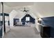 Bedroom with gray carpet, dark blue accent walls, and a mini fridge next to a white dresser at 4883 Snowberry Bay Ct, Carmel, IN 46033