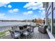 Spacious outdoor deck with dining and lounge seating, offering a relaxing lakeside view at 4883 Snowberry Bay Ct, Carmel, IN 46033