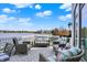 Charming outdoor deck with cozy seating, perfect for enjoying the serene lakeside atmosphere at 4883 Snowberry Bay Ct, Carmel, IN 46033