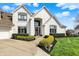 Attractive two-story home with well-manicured landscaping, a three-car garage, and inviting curb appeal at 4883 Snowberry Bay Ct, Carmel, IN 46033