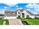 Inviting two-story home with a manicured lawn and classic architectural details at 4883 Snowberry Bay Ct, Carmel, IN 46033