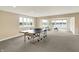 Finished basement game room featuring a ping pong table and natural light at 4883 Snowberry Bay Ct, Carmel, IN 46033