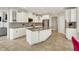 Gourmet kitchen with granite countertops, island with breakfast bar, and white cabinetry at 4883 Snowberry Bay Ct, Carmel, IN 46033