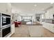 Bright, modern kitchen with an island, stainless steel appliances, and eat-in dining at 4883 Snowberry Bay Ct, Carmel, IN 46033