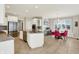 Well-lit kitchen featuring an island, stainless steel appliances, and eat-in dining area at 4883 Snowberry Bay Ct, Carmel, IN 46033