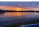 Lake at sunset offering vivid colors and serene views at 4883 Snowberry Bay Ct, Carmel, IN 46033