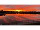 Beautiful lake at sunset, reflecting vibrant colors across the water at 4883 Snowberry Bay Ct, Carmel, IN 46033