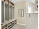 Functional mudroom with built-in storage cubbies and bench seating at 4883 Snowberry Bay Ct, Carmel, IN 46033