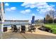 The pool and patio are next to the lake and feature lounge chairs for relaxing at 4883 Snowberry Bay Ct, Carmel, IN 46033