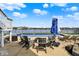 Backyard with a swimming pool and patio seating area with a beautiful lake view at 4883 Snowberry Bay Ct, Carmel, IN 46033