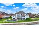Home's backyard oasis features a sparkling pool, patio and a neatly manicured lawn, perfect for entertaining at 4883 Snowberry Bay Ct, Carmel, IN 46033