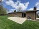 Spacious backyard featuring a patio and beautiful landscaping, perfect for outdoor entertaining and relaxation at 4912 Cayman Ct, Columbus, IN 47203