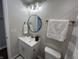 Elegant bathroom with a stylish vanity, round mirror, and a shower featuring a modern patterned curtain at 4912 Cayman Ct, Columbus, IN 47203