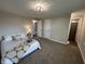Spacious bedroom with plush carpet, ample natural light, and a comfortable bed at 4912 Cayman Ct, Columbus, IN 47203