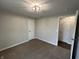 Inviting bedroom with ample light, featuring cozy carpet and convenient closet for comfortable living at 4912 Cayman Ct, Columbus, IN 47203