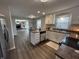 Open kitchen flows into living space, featuring stainless appliances and plenty of storage at 4912 Cayman Ct, Columbus, IN 47203