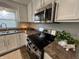 A modern kitchen featuring stainless steel appliances, bright cabinets, and beautiful countertops at 4912 Cayman Ct, Columbus, IN 47203