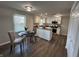 Eat-in kitchen featuring white cabinets, modern appliances, and stylish light fixtures at 4912 Cayman Ct, Columbus, IN 47203