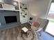 Cozy living room featuring a fireplace, built-in shelving, and a comfortable chair at 4912 Cayman Ct, Columbus, IN 47203