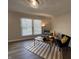 Bright living room featuring a sofa, accent chair, decorative rug, and plenty of sunlight at 4912 Cayman Ct, Columbus, IN 47203