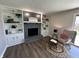 The living room features a brick fireplace with built-in shelving and modern decor at 4912 Cayman Ct, Columbus, IN 47203