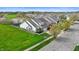 Aerial view displays neighborhood with fenced yards, ample green space, and close proximity to the pond at 4916 Franklin Villas Dr, Indianapolis, IN 46237