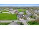 Aerial view showcases the neighborhood with a pond, green spaces, and well-maintained homes at 4916 Franklin Villas Dr, Indianapolis, IN 46237