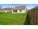 Spacious backyard with a well-maintained lawn, perfect for outdoor activities and entertainment at 4916 Franklin Villas Dr, Indianapolis, IN 46237