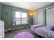 Bright bedroom with pastel butterfly decorations and large windows, offering a playful, cozy atmosphere at 4916 Franklin Villas Dr, Indianapolis, IN 46237