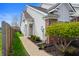 Charming home exterior with neat landscaping, a cozy walkway, and white vinyl siding at 4916 Franklin Villas Dr, Indianapolis, IN 46237